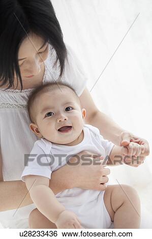 Stock Photograph - Mother With Baby Boy. Fotosearch