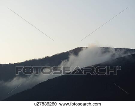 Stock Image - Mountain in Clouds. Fotosearch