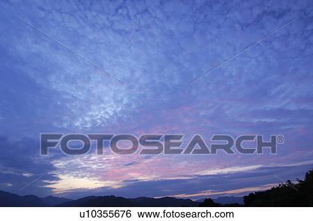 Stock Photograph - Mountain range at dusk, Kanagawa Prefecture, Honshu, Japan. Fotosearch