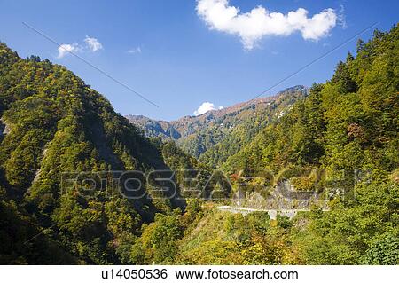 Stock Photograph - Mt. Hakusan in autumn and road, Ishikawa Prefecture, Honshu, Japan. Fotosearch