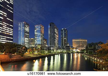 Office buildings and river at night, Osaka Prefecture, Honshu, Japan View Large Photo Image Stock Image - Office buildings and river at night, Osaka Prefecture, Honshu, Japan. Fotosearch