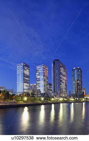 Office buildings and river at night, Osaka Prefecture, Honshu, Japan View Large Photo Image Stock Photo - Office buildings and river at night, Osaka Prefecture, Honshu, Japan. Fotosearch