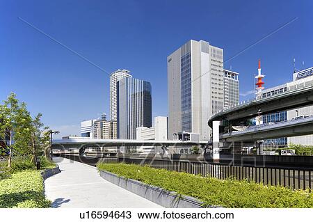 Stock Image - Office buildings, highway and Dojima river, Osaka Prefecture, Honshu, Japan. Fotosearch