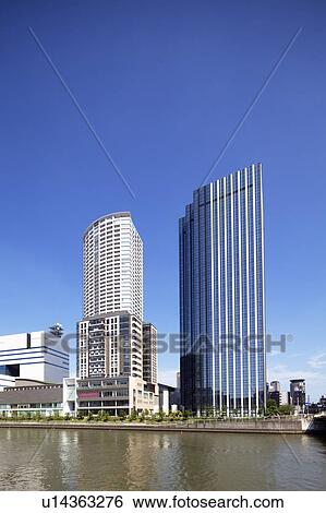 Stock Photograph - Office buildings, Hotarumachi and Dojima river, Osaka Prefecture, Honshu, Japan. Fotosearch