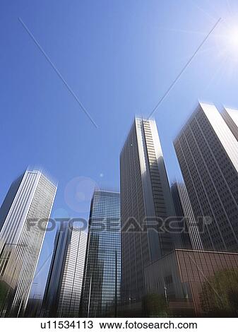 Stock Image - Office buildings, low angle view, Shinjuku Ward, Tokyo Prefecture, Honshu, Japan. Fotosearch