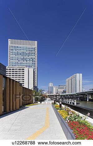 Office buildings, Nakanojima Garden bridge and Dojima river, Osaka Prefecture, Honshu, Japan View Large Photo Image Stock Photo - Office buildings, Nakanojima Garden bridge and Dojima river, Osaka Prefecture, Honshu, Japan. Fotosearch