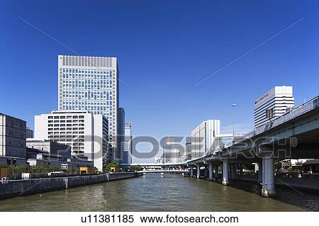 Office buildings, Nakanojima Garden bridge and Dojima river, Osaka Prefecture, Honshu, Japan View Large Photo Image Stock Photography - Office buildings, Nakanojima Garden bridge and Dojima river, Osaka Prefecture, Honshu, Japan. Fotosearch