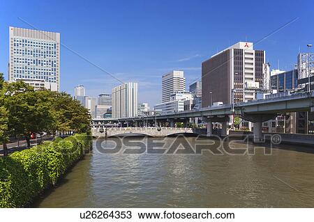 Stock Image - Office buildings, Oe bridge and Dojima river, Osaka Prefecture, Honshu, Japan. Fotosearch