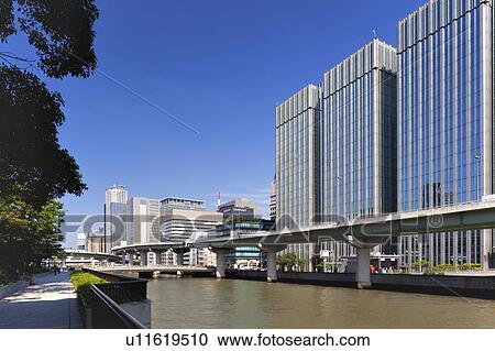 Stock Image - Office buildings, Watanabe bridge and Dojima river, Osaka Prefecture, Honshu, Japan. Fotosearch