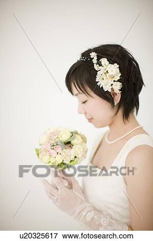 Stock Photo - Portrait of Bride With Bouquet. Fotosearch