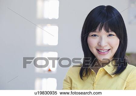 Stock Photography - Portrait of Happy Young Woman. Fotosearch