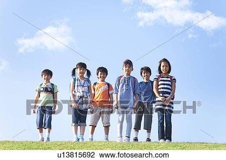 Portrait of school children at riverbank, standing side by side View Large Photo Image Stock Image - Portrait of school children at riverbank, standing side by side. Fotosearch