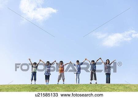Portrait of school children at riverbank, standing side by side, copy space View Large Photo Image Stock Image - Portrait of school children at riverbank, standing side by side, copy space. Fotosearch