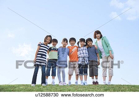 Portrait of school children with female teacher at riverbank View Large Photo Image Stock Image - Portrait of school children with female teacher at riverbank. Fotosearch