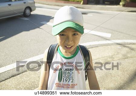 Stock Image - Portrait of schoolboy, smiling. Fotosearch