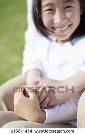 Picture - Portrait of Young Girl With her Mother. Fotosearch