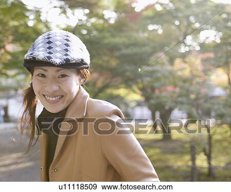 Portrait of Young Woman Outdoors View Large Photo Image Stock Photo - Portrait of Young Woman Outdoors. Fotosearch