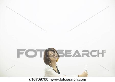 Portrait of young woman smiling, white background, copy space View Large Photo Image Stock Image - Portrait of young woman smiling, white background, copy space. Fotosearch