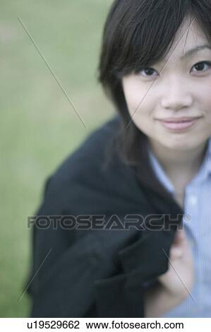 Stock Image - Portrait of young woman . Fotosearch
