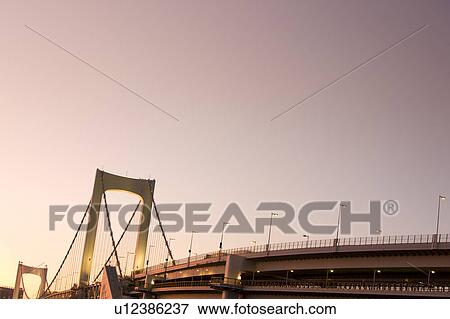 Stock Photo - Rainbow bridge at dusk, Tokyo Prefecture, Honshu, Japan. Fotosearch
