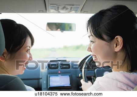 Rear View of Two Young Women Talking in Car View Large Photo Image Stock Photography - Rear View of Two Young Women Talking in Car. Fotosearch