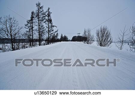 Road covered in snow, Hokkaido Prefecture, Japan View Large Photo Image Stock Photo - Road covered in snow, Hokkaido Prefecture, Japan. Fotosearch