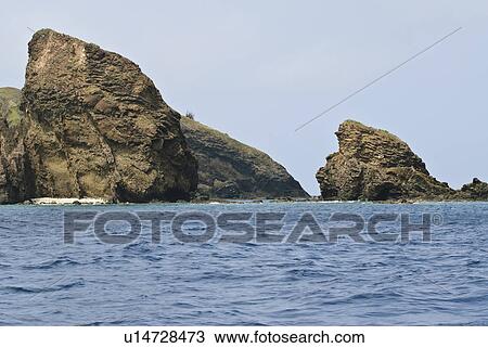 Stock Image - Rock Formations in Sea. Fotosearch