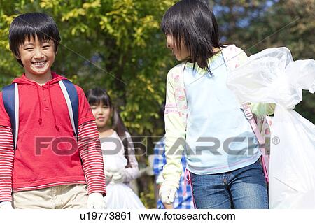 School children carrying bags for recycling View Large Photo Image Stock Image - School children carrying bags for recycling. Fotosearch