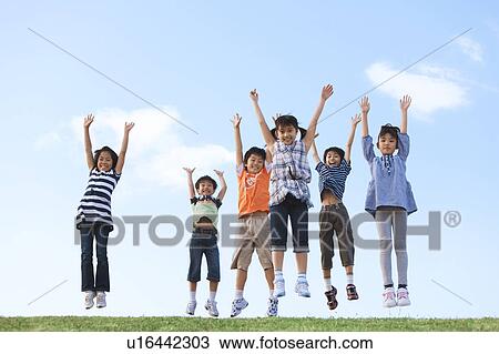 School children jumping at riverbank View Large Photo Image Stock Image - School children jumping at riverbank. Fotosearch