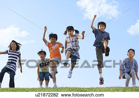 School children jumping at riverbank View Large Photo Image Stock Image - School children jumping at riverbank. Fotosearch
