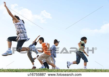 School children jumping at riverbank View Large Photo Image Stock Photo - School children jumping at riverbank. Fotosearch