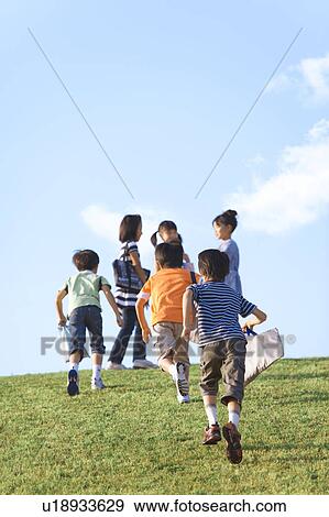 School children running at riverbank, copy space View Large Photo Image Stock Photo - School children running at riverbank, copy space. Fotosearch