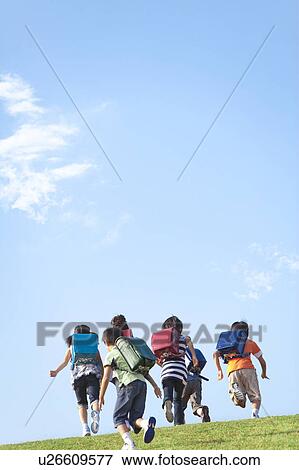 School children running at riverbank, copy space View Large Photo Image Stock Photo - School children running at riverbank, copy space. Fotosearch