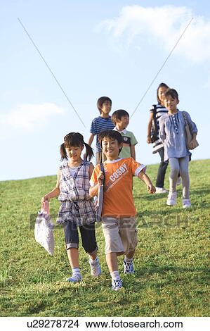 School children walking at riverbank View Large Photo Image Picture - School children walking at riverbank. Fotosearch