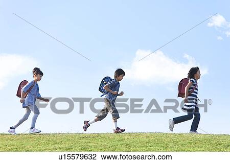 School children walking at riverbank, copy space View Large Photo Image Stock Image - School children walking at riverbank, copy space. Fotosearch