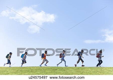 School children walking at riverbank, copy space View Large Photo Image Stock Photo - School children walking at riverbank, copy space. Fotosearch