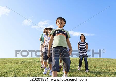 School children with female teacher at riverbank, smiling View Large Photo Image Stock Image - School children with female teacher at riverbank, smiling. Fotosearch