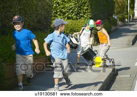 Schoolboys running the street View Large Photo Image Stock Image - Schoolboys running the street. Fotosearch