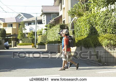 Schoolboys walking the street View Large Photo Image Stock Image - Schoolboys walking the street. Fotosearch