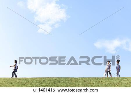 Stock Photography - Schoolgirls at riverbank, copy space. Fotosearch
