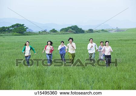 Seven Young Women and Men Running in Field View Large Photo Image Stock Image - Seven Young Women and Men Running in Field. Fotosearch
