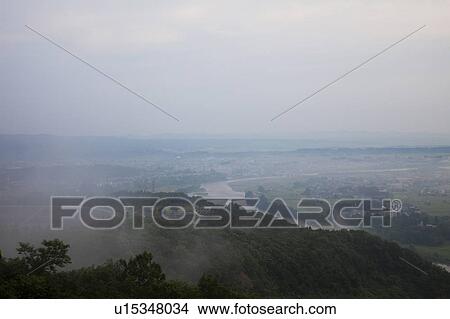 Picture - Shinano river at dawn and cityscape of Ojiya city, Niigata Prefecture, Honshu, Japan. Fotosearch