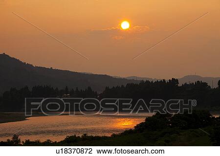 Stock Image - Shinano river at dusk, Niigata Prefecture, Honshu, Japan. Fotosearch