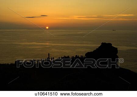 Silhouette of people watching sunset, Okinawa Prefecture, Japan View Large Photo Image Stock Image - Silhouette of people watching sunset, Okinawa Prefecture, Japan. Fotosearch