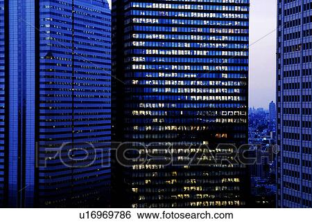 Stock Photograph - Skyscrapers of Shinjuku Ward at dusk, Tokyo Prefecture, Honshu, Japan. Fotosearch