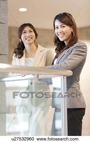 Stock Image - Smiling business women. Fotosearch