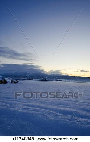Snow covered field at dawn, Hokkaido Prefecture, Japan View Large Photo Image Stock Photo - Snow covered field at dawn, Hokkaido Prefecture, Japan. Fotosearch