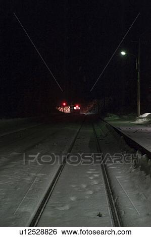 Stock Photograph - Snow covered railroad station at night, Hokkaido Prefecture, Honshu, Japan. Fotosearch