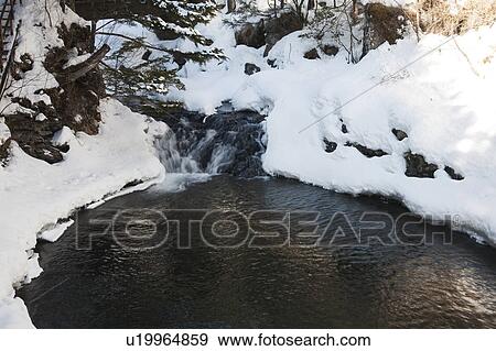 Stock Photo - Snowscape of Waterfall and River. Fotosearch