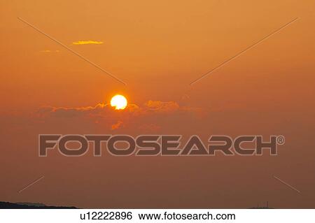Stock Photograph - Sun at dusk, Niigata Prefecture, Honshu, Japan. Fotosearch